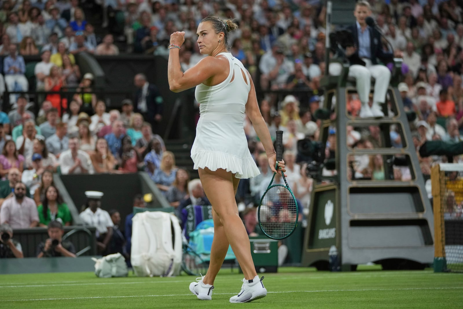Aryna Sabalenka of Belarus reacts after winning the first set against Emma Raducanu of Britain during a third round women's singles match at the Wimbledon Tennis Championships in London, Friday, July 4, 2025. (AP Photo/Kin Cheung)