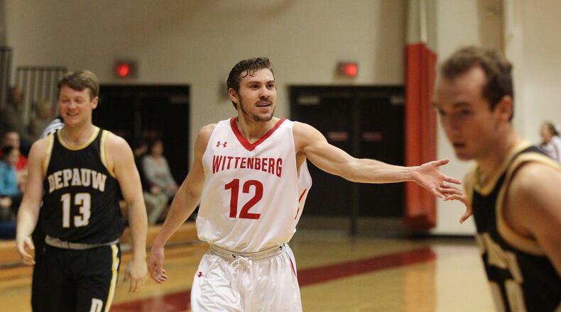 Wittenberg’s Mitch Balser celebrates after a 3-pointer at the end of the first half against DePauw on Wednesday, Jan. 24, 2018, at Pam Evans Smith Arena in Springfield. David Jablonski/Staff