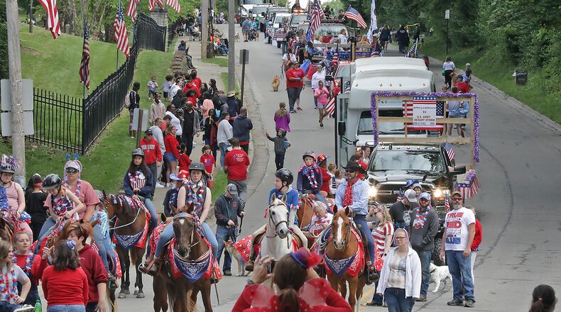 The annual Springfield Memorial Day Parade is set to take place this year amid the pandemic. Hundreds of people cheered and waved flags along the streets of Springfield last year as the annual Memorial Day Parade returned after being canceled in 2020 due to COVID-19. BILL LACKEY/STAFF