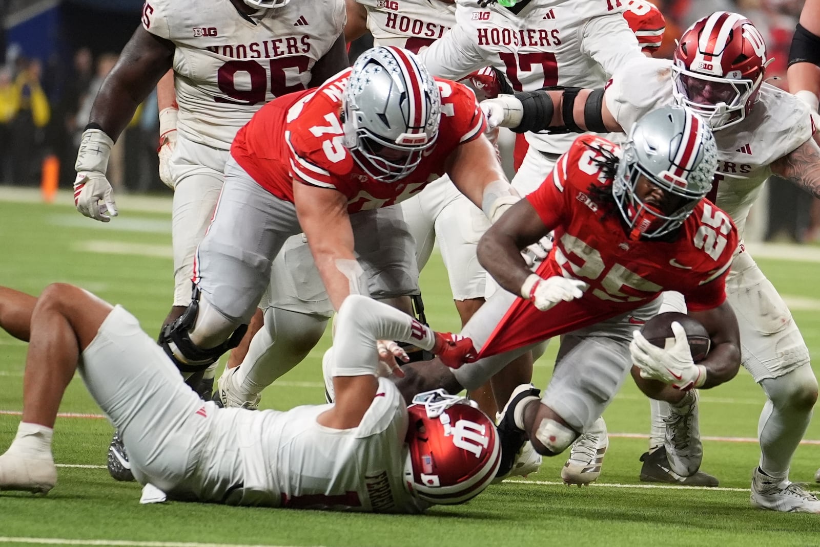 Indiana's Amare Ferrell stops Ohio State's Bo Jackson during the second half of the Big Ten championship NCAA college football game in Indianapolis, Saturday, Dec. 6, 2025. (AP Photo/Michael Conroy)