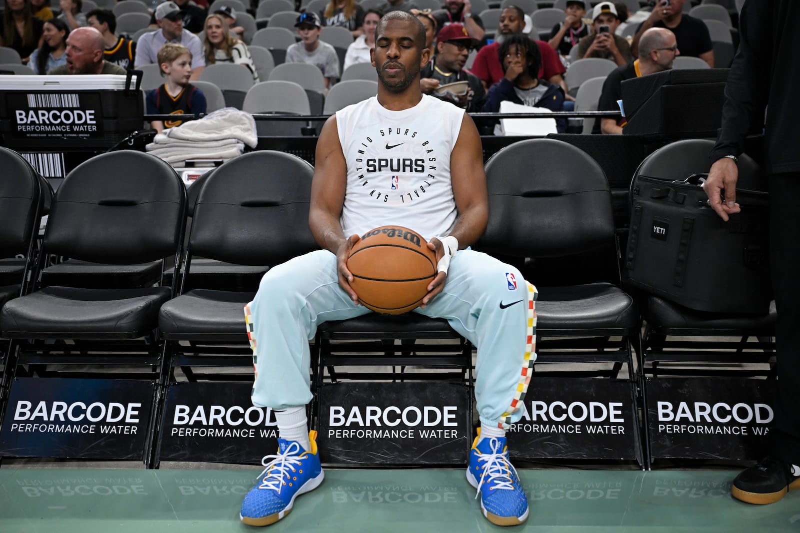FILE - San Antonio Spurs guard Chris Paul sits on the Cleveland Cavaliers bench before an NBA basketball game, April 4, 2025, in San Antonio. (AP Photo/Darren Abate, File)