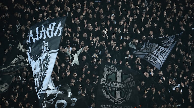 PAOK's fans wave giant flags of their team during the Europa League soccer match between PAOK and Real Betis in Thessaloniki, Greece, Thursday, Jan. 22, 2026. (AP Photo/Giannis Papanikos)