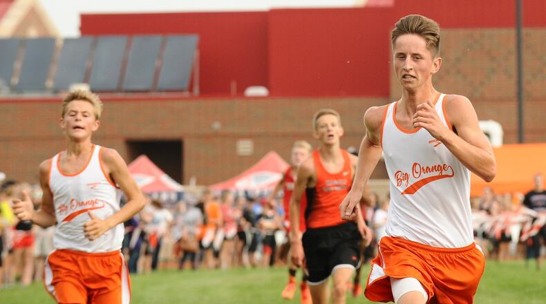 West Liberty-Salem junior Noah Smith (right) finished second and freshman Dylan Lauck finished fourth to pace the Big Orange at the Bob Schul Invitational on Saturday. Contributed / Greg Billing