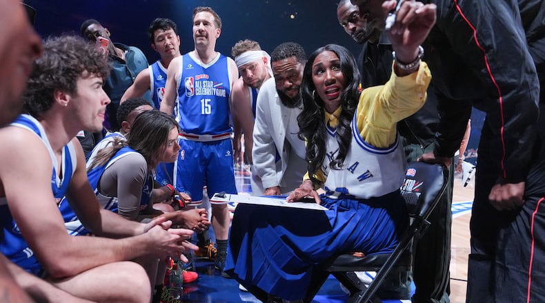 Former WNBA star Lisa Leslie, second from right, talks to players during an NBA basketball's All-Star Celebrity Game Friday, Feb. 13, 2026, in Inglewood, Calif. (AP Photo/Jae C. Hong)