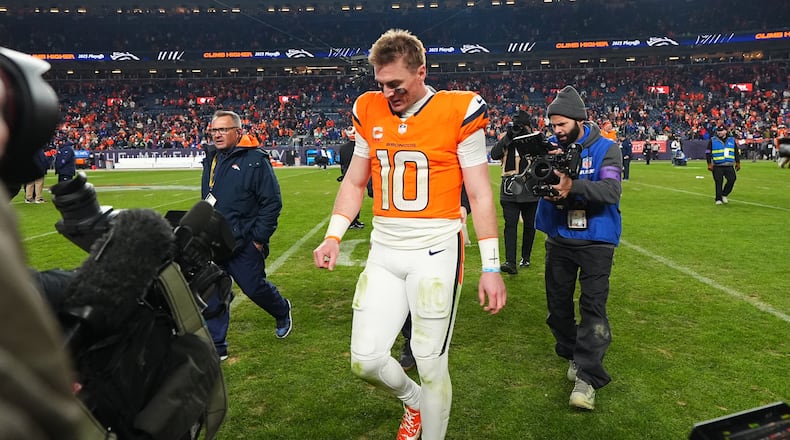 Denver Broncos quarterback Bo Nix leaves the field after an NFL divisional round playoff football game against the Buffalo Bills, Saturday, Jan. 17, 2026, in Denver. (AP Photo/Jack Dempsey)
