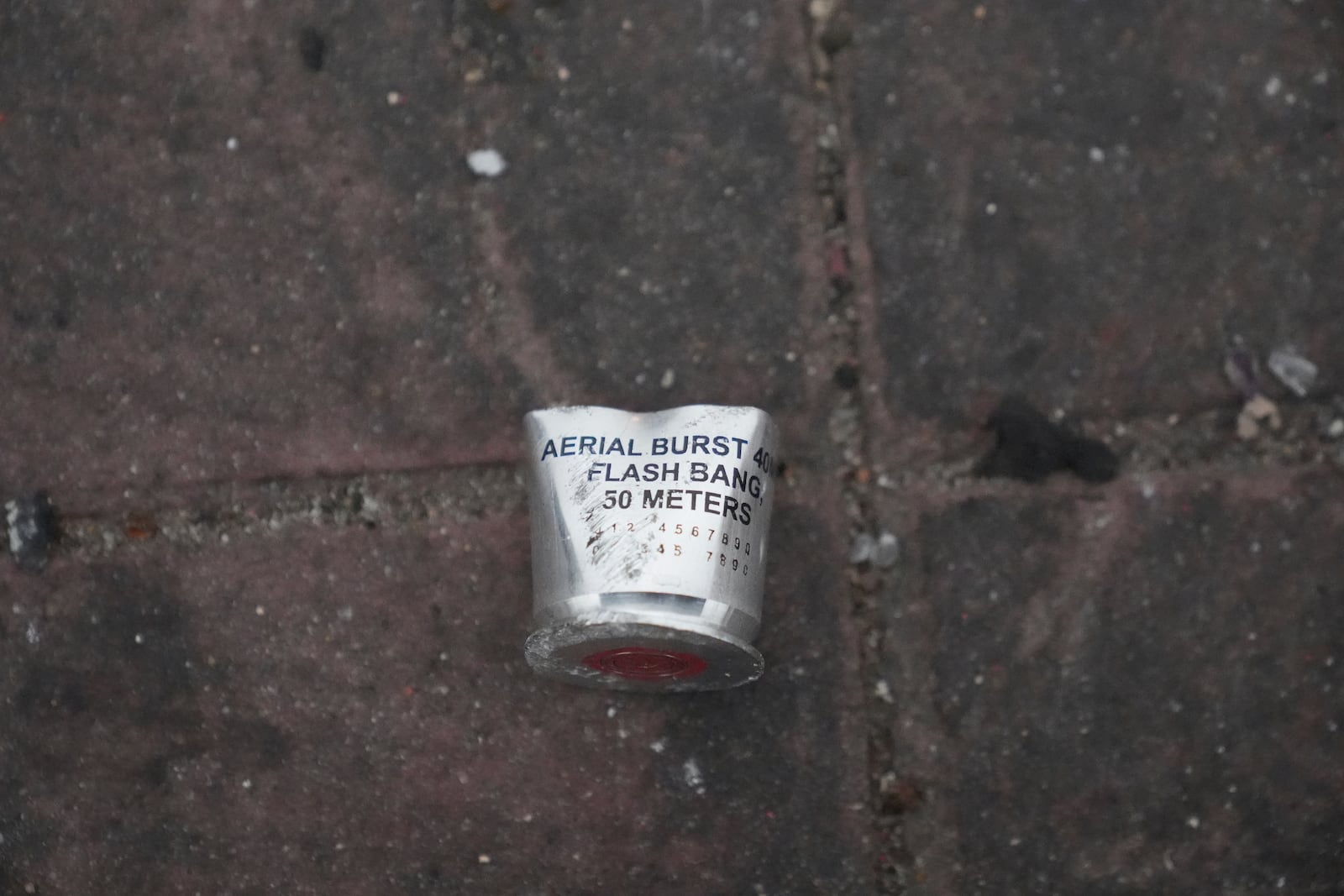 A flash bang canister lies in the street Sunday, June 8, 2025, in Compton, Calif., following an immigration raid protest the night before. (AP Photo/Jae Hong)