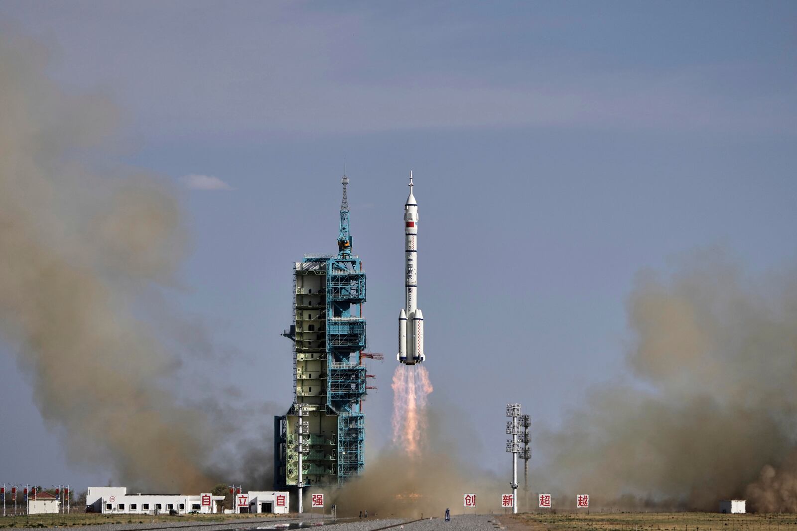 China's Long March 2F rocket, carrying three astronauts for the Shenzhou 20 manned space mission, lifts off for a space station, at the Jiuquan Satellite Launch Center in Jiuquan, northwestern China, Thursday, April 24, 2025. (AP Photo/Andy Wong)