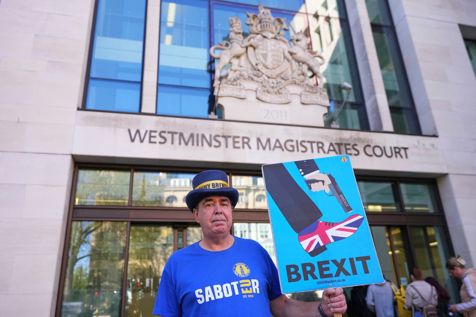 Anti-Brexit campaigner Steve Bray poses as he arrives at Westminster Magistrates Court in London, Monday, April 14, 2025. (AP Photo/Kirsty Wigglesworth)