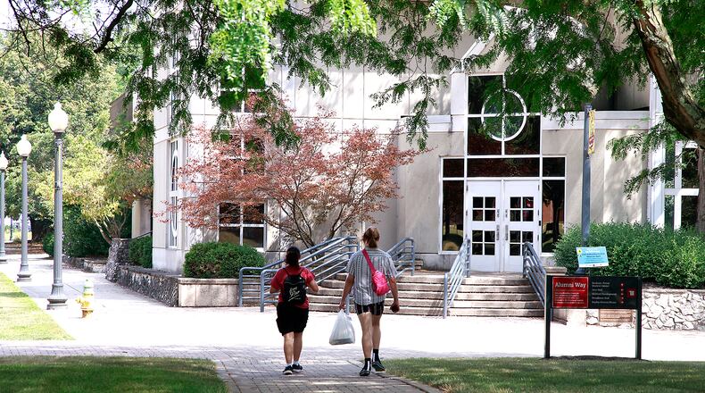 Two students walk across the campus of Wittenberg University Thursday, August 1, 2024. BILL LACKEY/STAFF