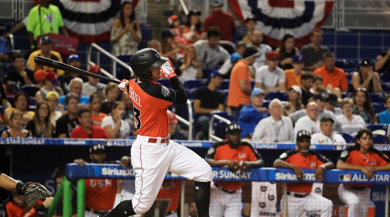 Nick Senzel of the Reds and the U.S. Team hits an RBI double in the first inning against the World Team during Monday's SiriusXM All-Star Futures Game at Marlins Park.