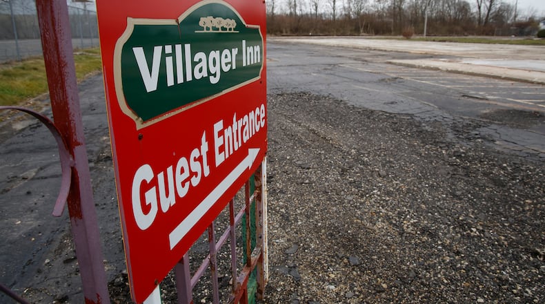 A metal gate is all that's left of the Villager Inn Monday, Dec. 4, 2023. The City of Springfield had the hotel demolished after a fire earlier this year. BILL LACKEY/STAFF