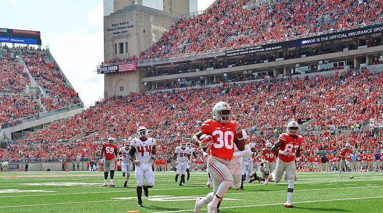 COLUMBUS, OH - OCTOBER 1:  Demario McCall #30 of the Ohio State Buckeyes scores on a 20-yard touchdown run in the third quarter against the Rutgers Scarlet Knights at Ohio Stadium on October 1, 2016 in Columbus, Ohio. Ohio State defeated Rutgers 58-0.  (Photo by Jamie Sabau/Getty Images)