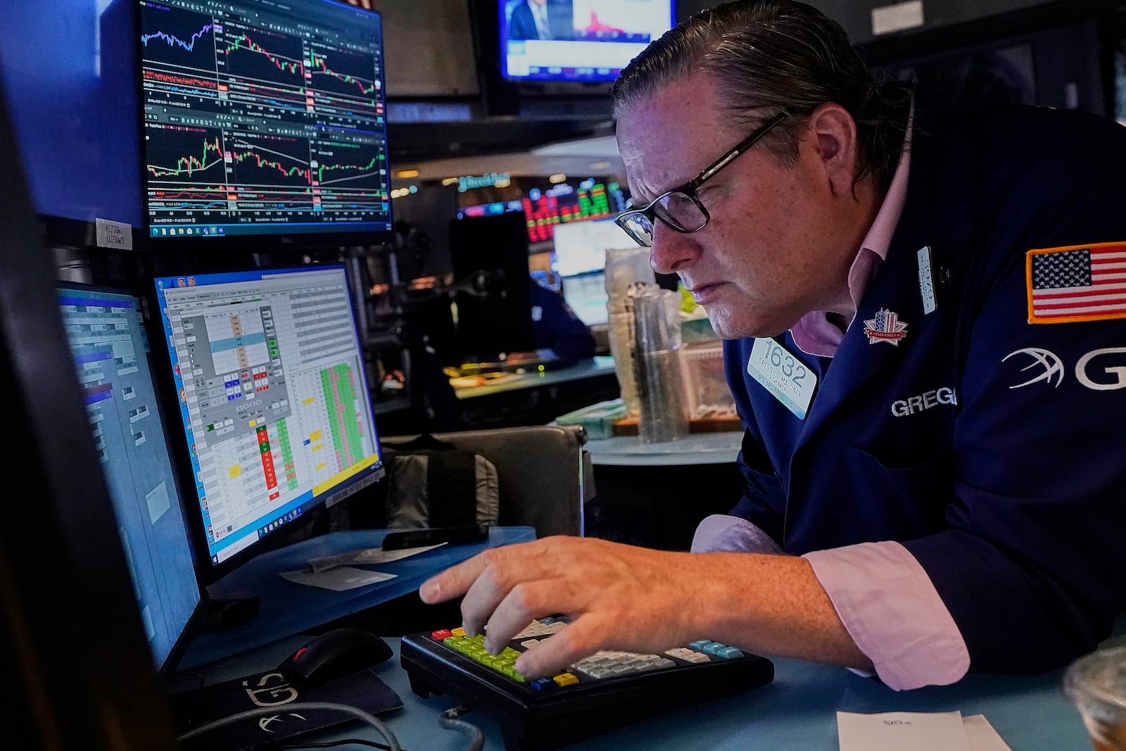 Specialist Gregg Maloney works at his post on the floor of the New York Stock Exchange, Tuesday, July 1, 2025. (AP Photo/Richard Drew)