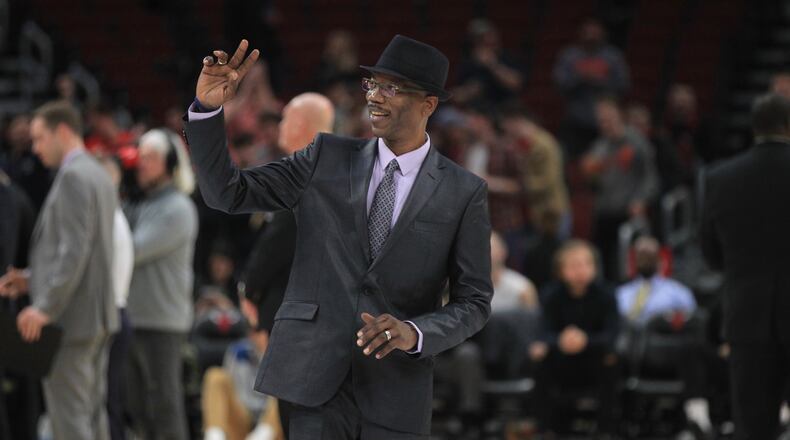 Dayton great Roosevelt Chapman waves to the crowd while being honored during a game against Colorado on Saturday, Dec. 21, 2019, at the United Center in Chicago.
