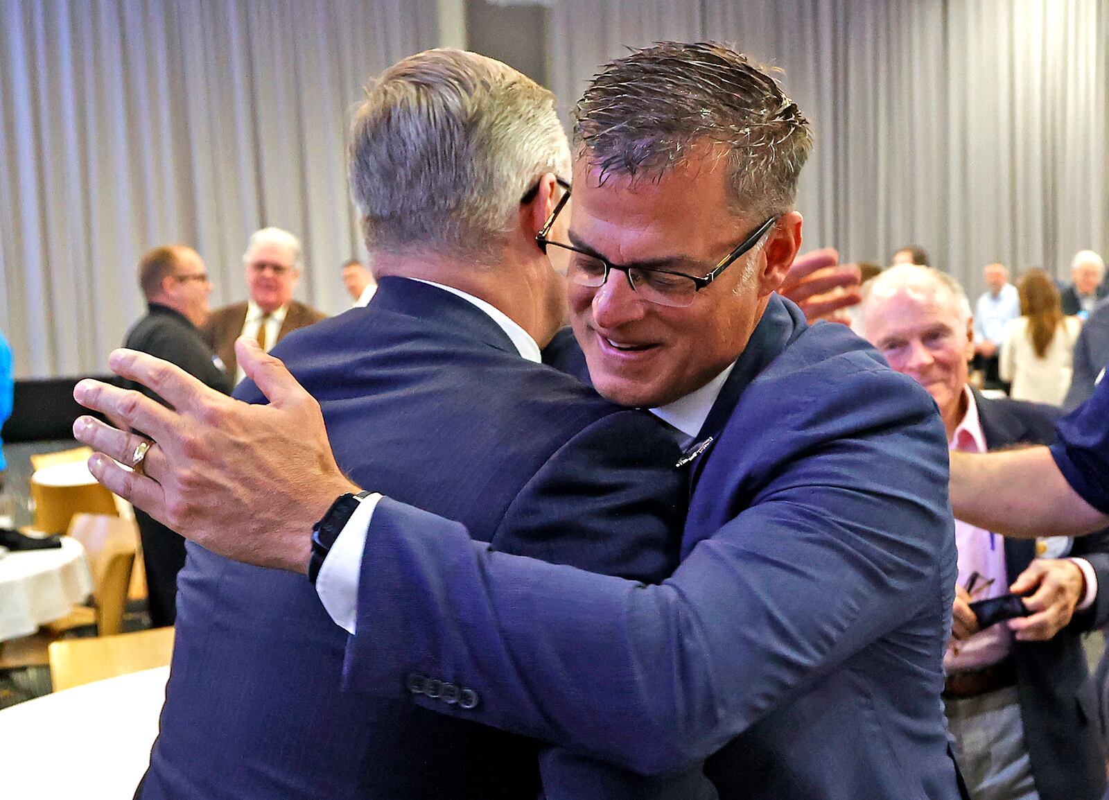 Former Clark County Prosecutor Andy Wilson, is greeted by old friends after talking about his new roll as director of the Ohio Department of Public Safety Monday, April 10, 2023 during the Springfield Rotary Club's weekly meeting. BILL LACKEY/STAFF