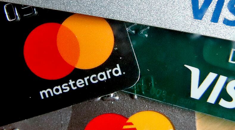 FILE - In this Feb. 20, 2019, file photo are Mastercard and Visa credit cards in Zelienople, Pa. (AP Photo/Keith Srakocic, File)