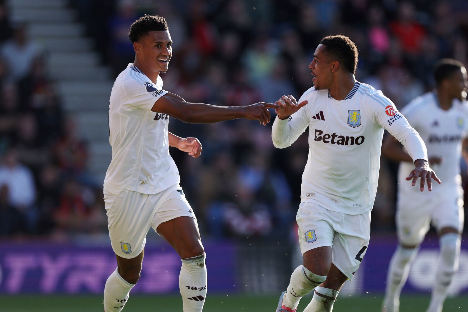 Aston Villa's Ollie Watkins, left, celebrates scoring with Jacob Ramsey during the English Premier League soccer match between Bournemouth and Aston Villa at the Vitality Stadium, Bournemouth, England, Saturday May 10, 2025. (Steven Paston/PA via AP)