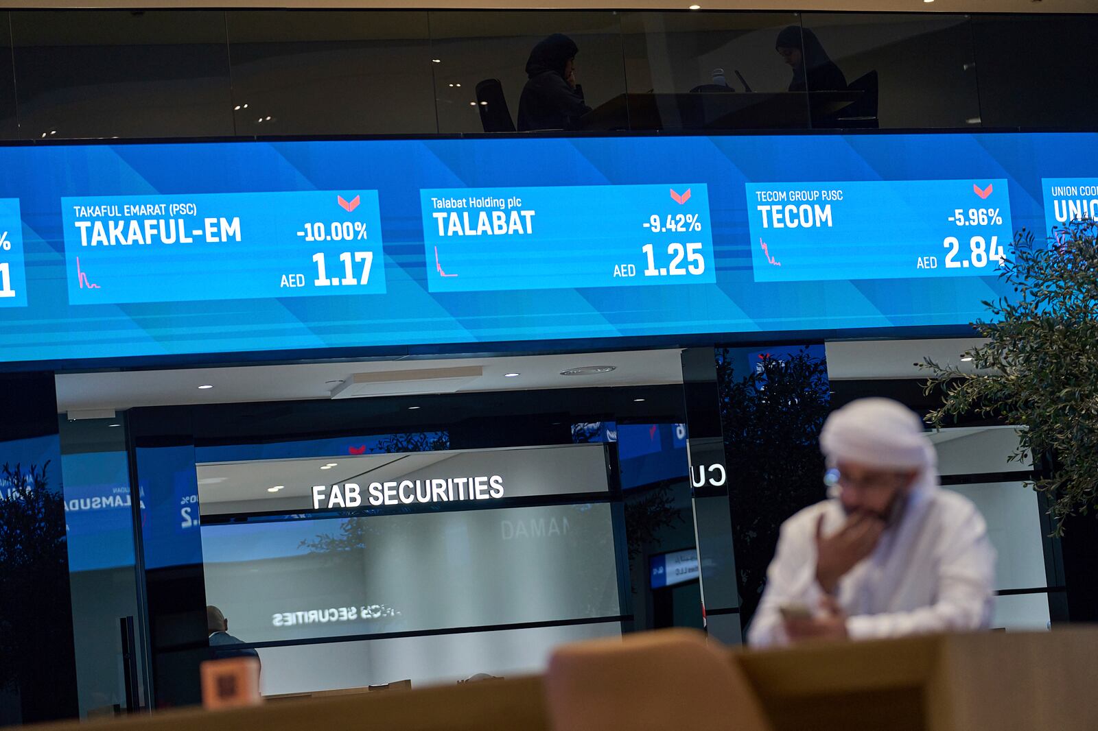 An Emirati man is seen in the Dubai Financial Market in Dubai, United Arab Emirates, Monday, April 7, 2025. (AP Photos/Fatima Shbair)