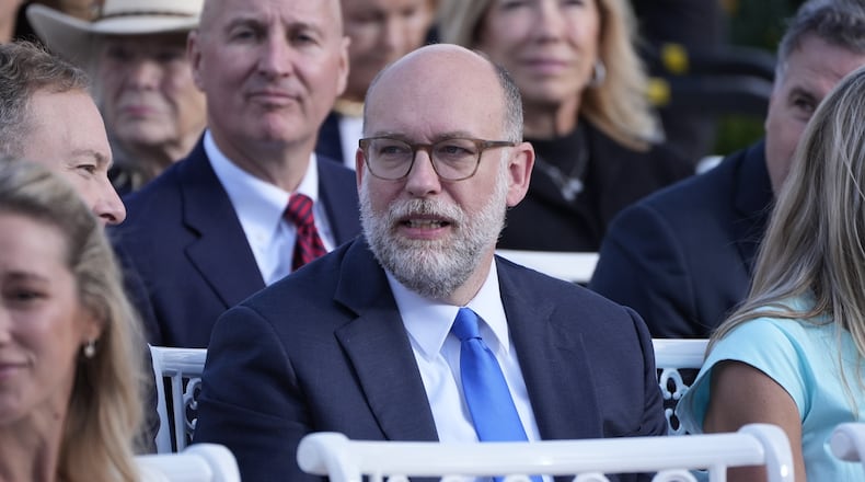 Russell Vought, Director of the Office of Management and Budget, attends a ceremony where President Donald Trump will present the Presidential Medal of Freedom for Charlie Kirk to his widow Erika Kirk in the Rose Garden of the White House, Tuesday, Oct. 14, 2025, in Washington. (AP Photo/Mark Schiefelbein)