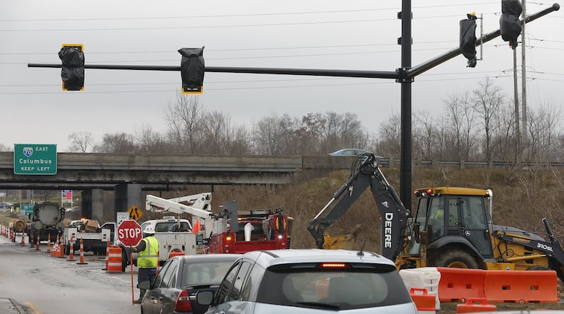 A file photo of the Ohio Department of Transportation installing traffic signals at the intersection of I-70 and South Limestone Street. Bill Lackey/Staff