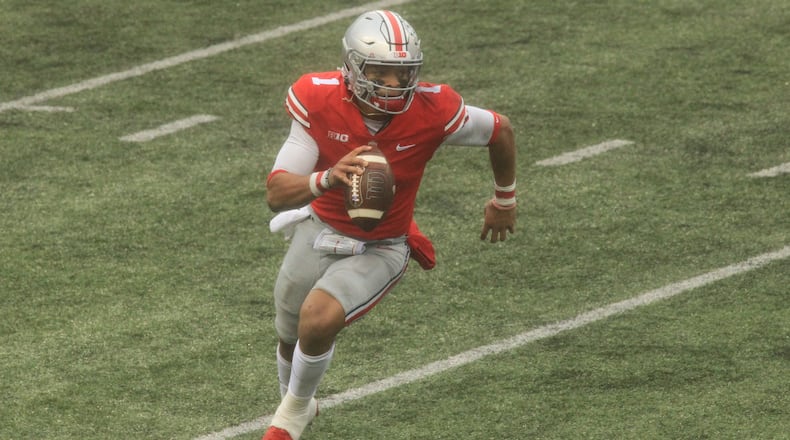 Ohio State's Justin Fields runs against Indiana on Saturday, Nov. 22, 2020, at Ohio Stadium in Columbus. David Jablonski/Staff