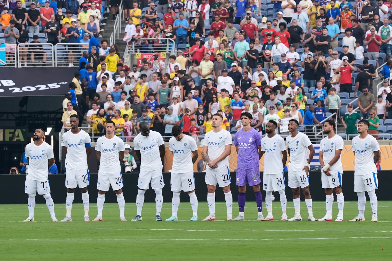 Players of the two teams observe a minute of silence in memory of Portugal international and Liverpool player Diogo Jota and his brother Andre Silva, before the Club World Cup quarterfinal soccer match between Fluminense and Al Hilal in Orlando, Fla., Friday, July 4, 2025. (AP Photo/John Raoux)