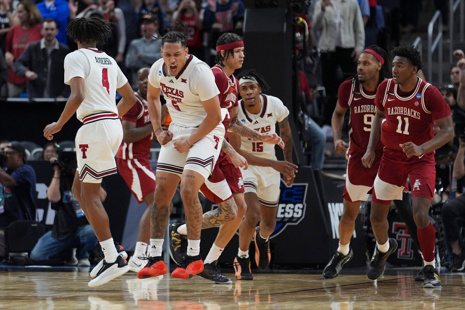 Texas Tech forward Darrion Williams (5) celebrates after scoring during overtime in the Sweet 16 of the NCAA college basketball tournament game against Arkansas, Thursday, March 27, 2025, in San Francisco. (AP Photo/Marcio Jose Sanchez)