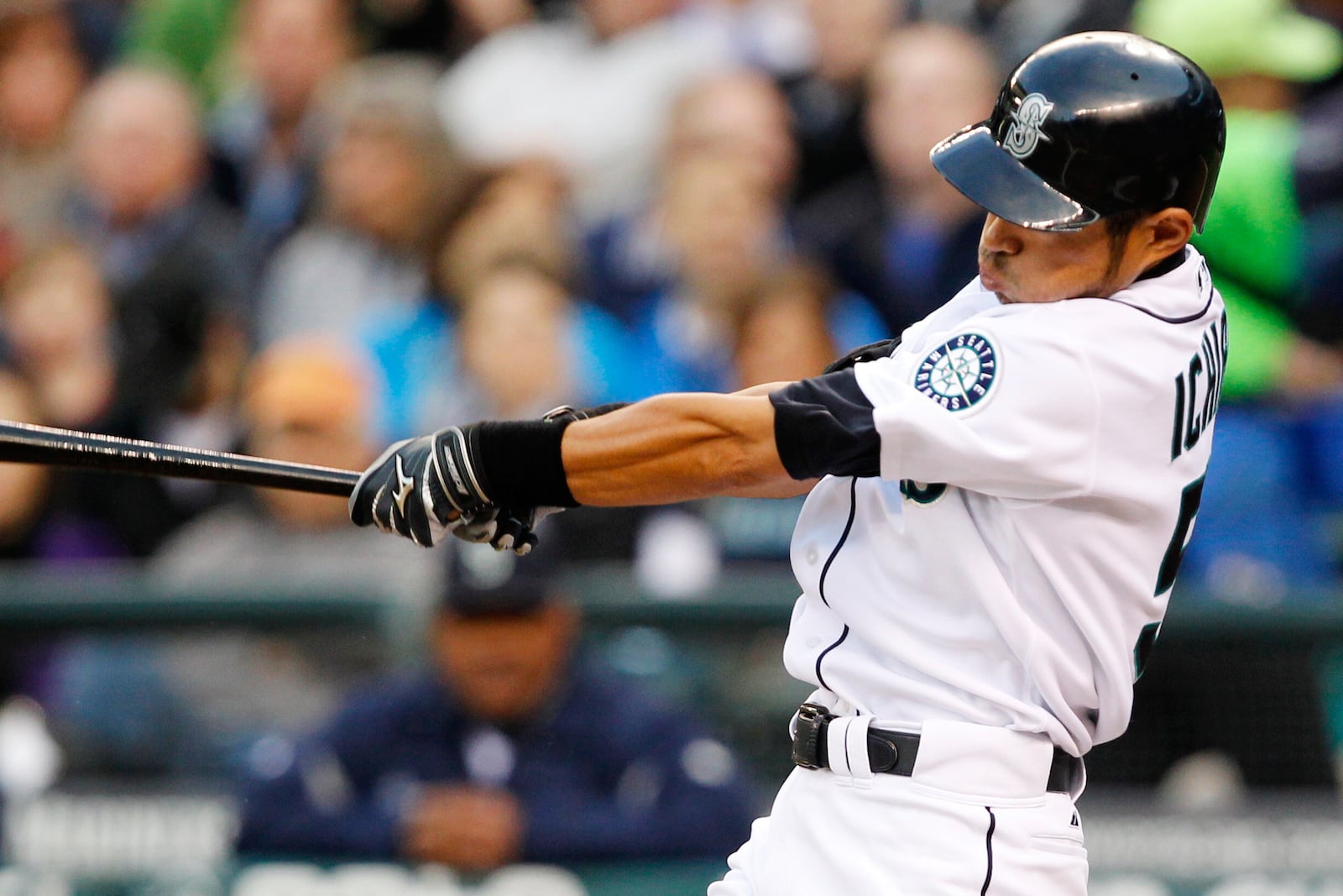 FILE - Seattle Mariners' Ichiro Suzuki hits a home run in the first inning of a baseball game against the Cleveland Indians, Wednesday, April 18, 2012, in Seattle. (AP Photo/Elaine Thompson, File)