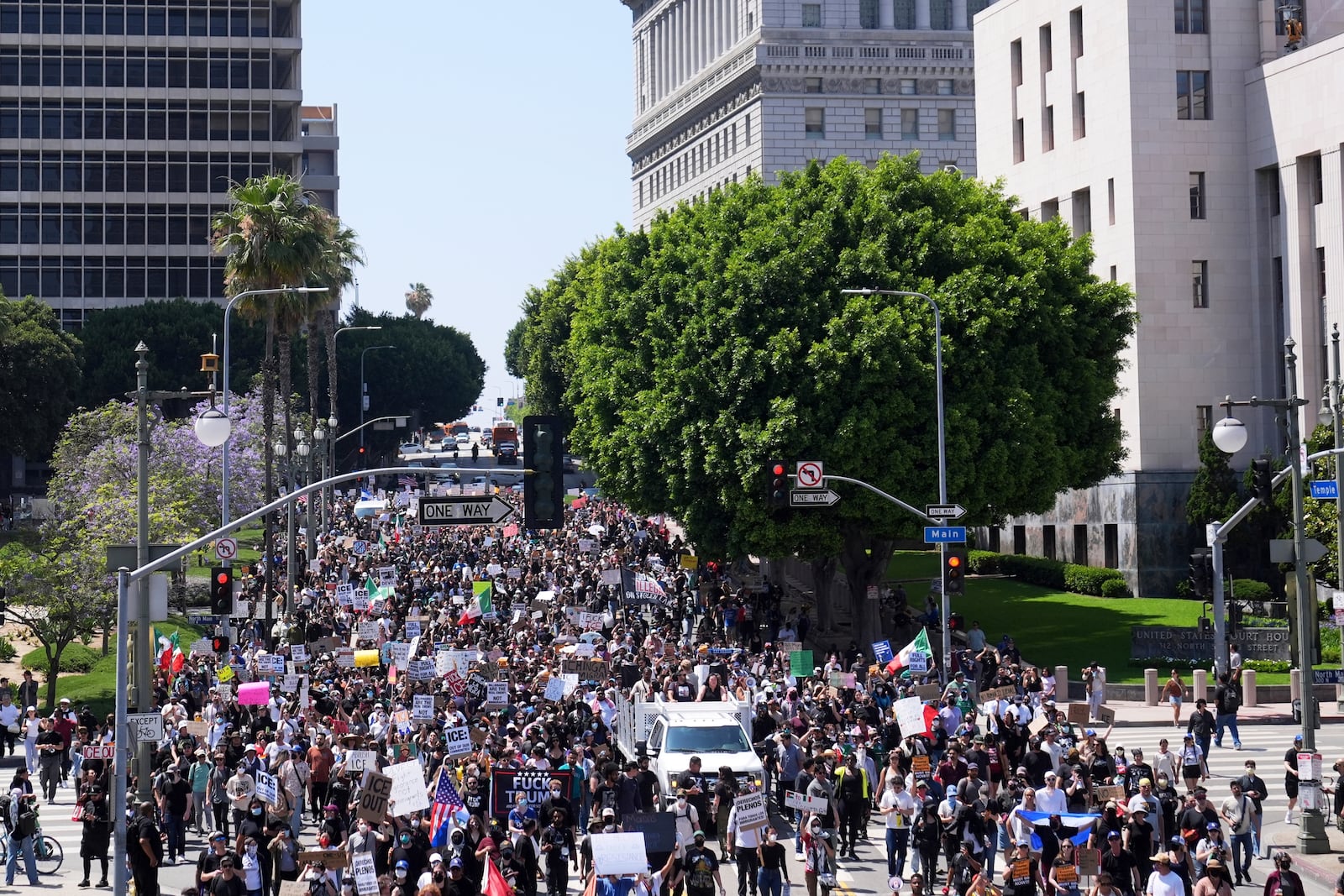 Protesters from the city hall to the metropolitan detention center of downtown Los Angeles, Sunday, June 8, 2025, following last night's immigration raid protest. (AP Photo/Jae Hong)
