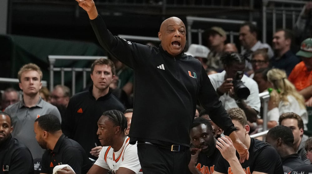 FILE - Miami head coach Bill Courtney gestures during the first half of an NCAA college basketball game against Duke, Tuesday, Feb. 25, 2025, in Coral Gables, Fla. (AP Photo/Marta Lavandier, File)