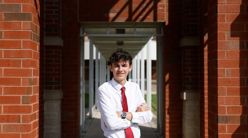 Senior Chase Tipton poses for a portrait on Friday, May 16, 2025, at Tecumseh High School. His mother and father passed away within the last year. JOSEPH COOKE/STAFF