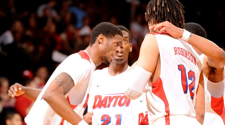 The Dayton Flyers huddle up during the second half of action against rival Xavier. The Flyers defeated Xavier 70-59 at UD Arena.