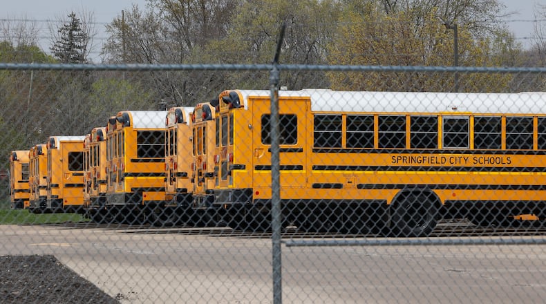 Buses sit in a parking on Monday, April 14, 2025, at the Springfield School Bus Facility. Springfield Schools were closed because of bus driver illnesses and a shortage of people to cover routes. JOSEPH COOKE/STAFF