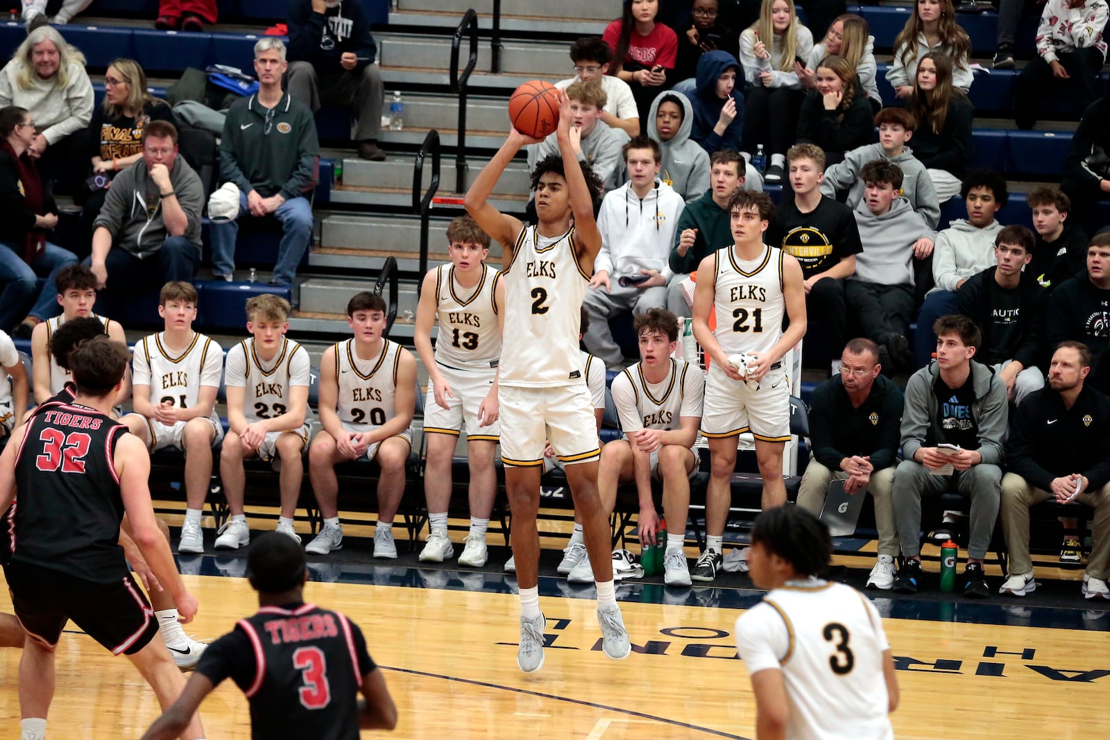 Centerville freshman Julian Sam puts up a three-point attempt in front of his bench. Fishers (Ind.) defeated Centerville 55-43 on Saturday, Jan. 17, 2026, at The Beacon Orthopaedics Flyin' to the Hoop showcase at Trent Arena in Kettering. STEVEN WRIGHT / STAFF