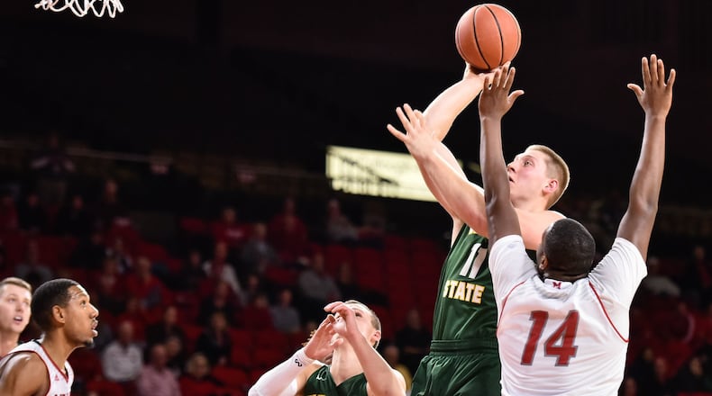 Wright State’s Loudon Love puts up a shot over Miami’s Bam Bowman during their game Tuesday, Nov. 14 at Millett Hall on the Miami University Campus in Oxford. NICK GRAHAM/STAFF