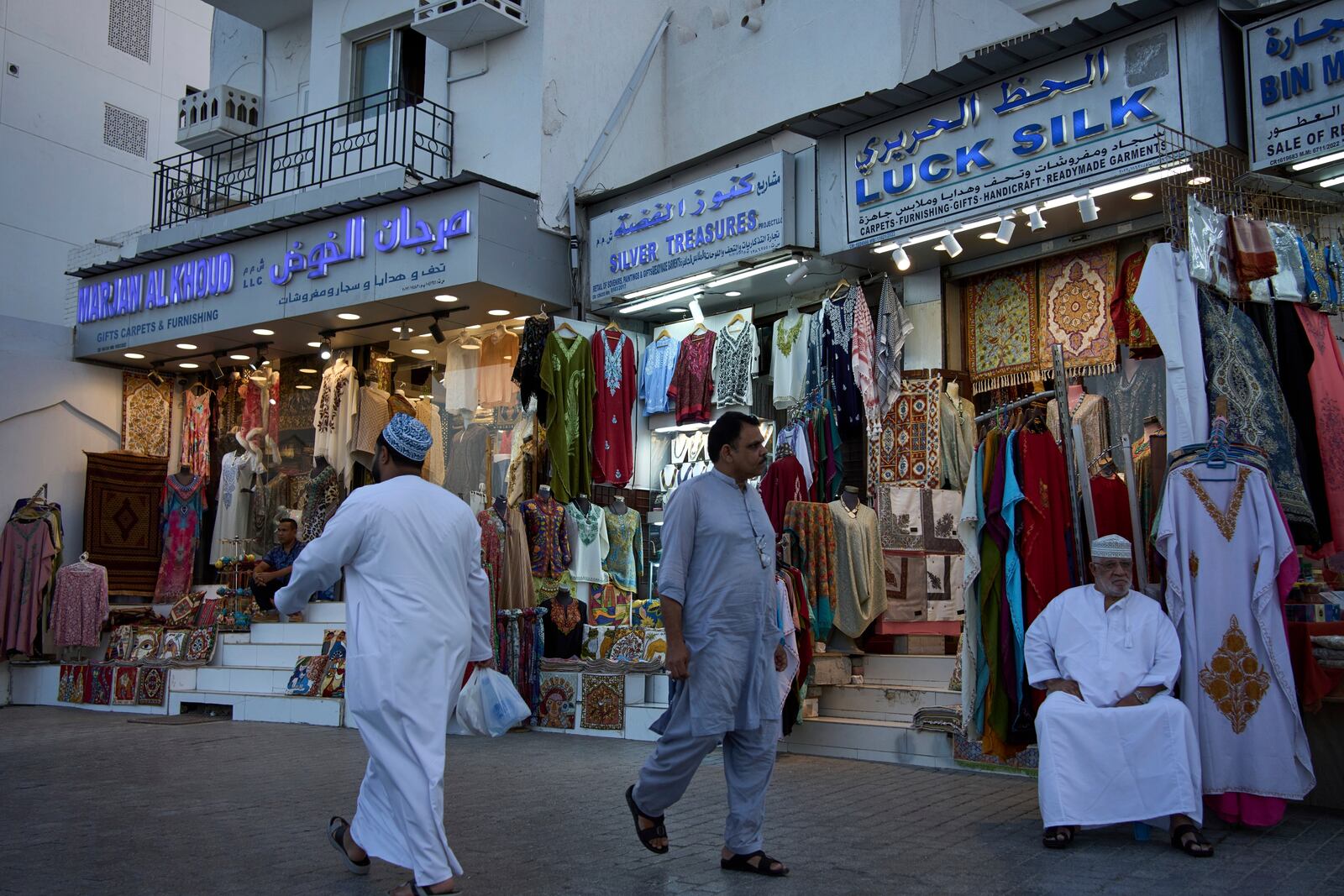 People walk through Mutrah Souq in Muscat, Oman, Friday, April 11, 2025. (AP Photo/ Fatima Shbair)