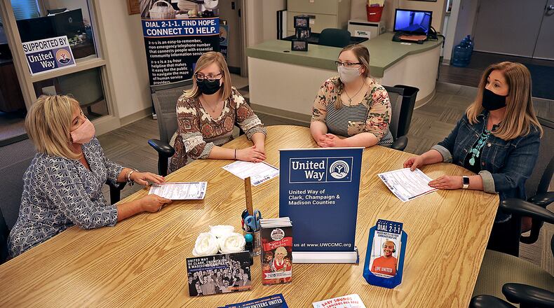 The United Way staff has a meeting in their Springfield office Thursday. The staff members are, from left, Kerry Pedraza, Kara Van Zant, Lacey Rexrode and Lorie Hale. BILL LACKEY/STAFF