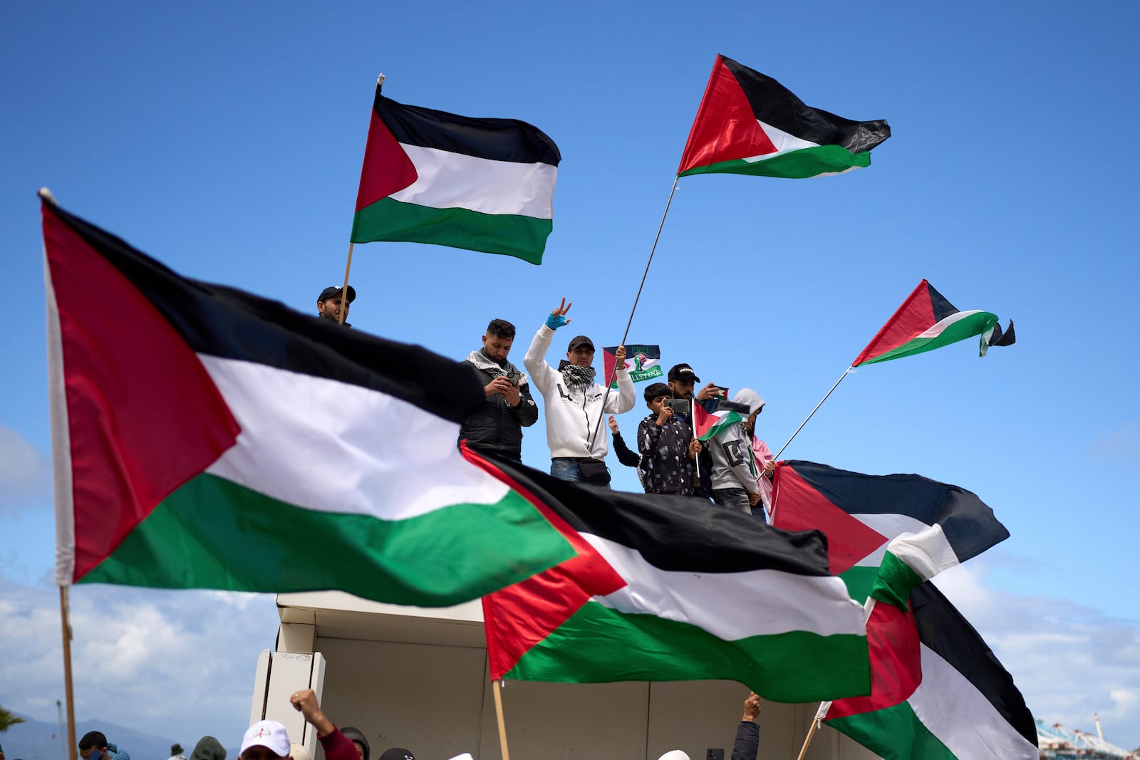 Moroccans protest the docking of a Maersk cargo ship carrying airplane parts they suspect are headed to Israel, outside Tangier Med Port, Sunday, April 20, 2025. (AP Photo/Mosa'ab Elshamy)