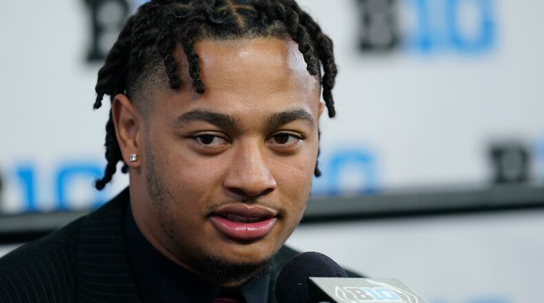 Ohio State wide receiver Jaxon Smith-Njigba talks to reporters during an NCAA college football news conference at the Big Ten Conference media days at Lucas Oil Stadium, Wednesday, July 27, 2022, in Indianapolis. (AP Photo/Darron Cummings)