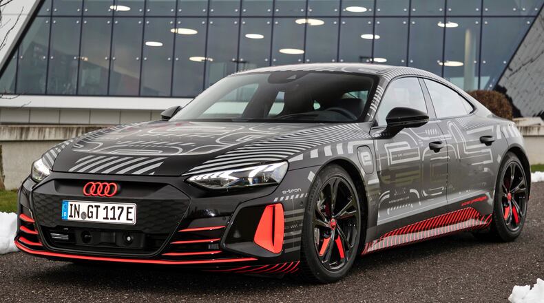 This photo provided by Audi shows the Audi e-tron GT prototype, a fully electric sport sedan that promises equal parts speed and long-distance comfort. (Daniel Wollstein/Audi via AP)