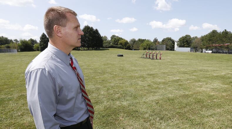 Southeastern School Superintendent David Shea looks over the field beside as he describes where a new multi purpose athletic building would be built. Bill Lackey>Staff