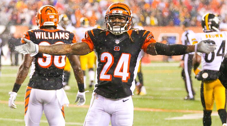 Bengals defensive back Adam Jones (24) fires up the crowd during their wild card playoff game against the Steelers at Paul Brown Stadium in Cincinnati, Saturday, Jan. 9, 2016. NICK GRAHAM / STAFF