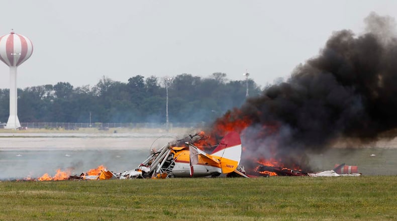 Wing walker Jane Wicker and biplane pilot Charlie Schwenker perished in this crash at the Vectren Dayton Air Show at approximately 12:45 p.m. on Saturday, June 22. TY GREENLEES / STAFF