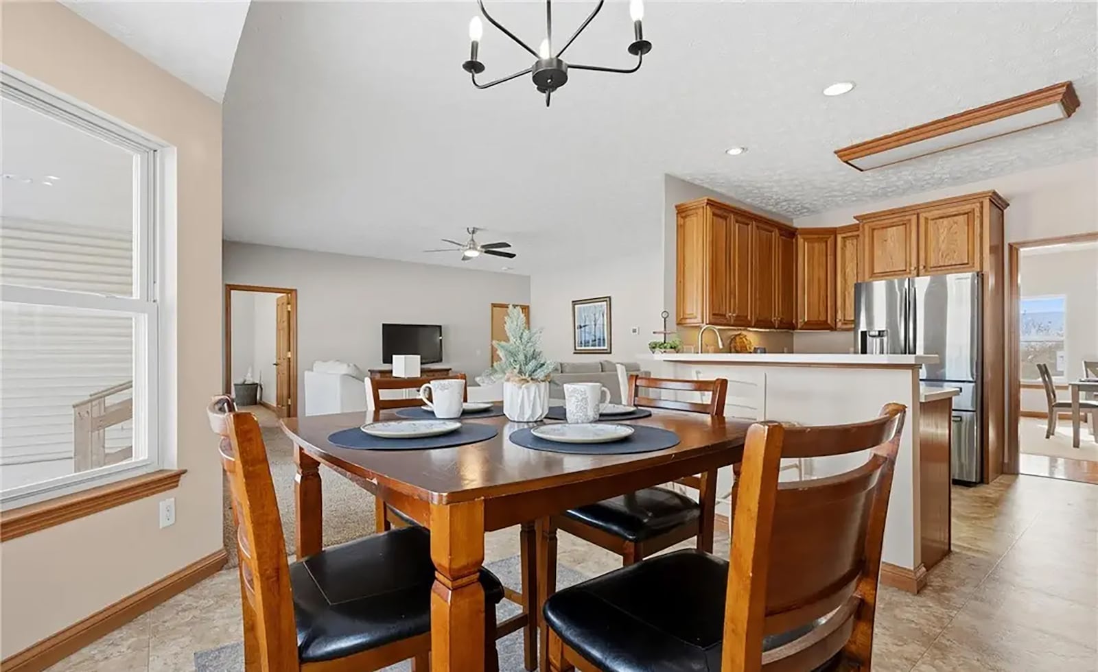 The eat in kitchen has tile flooring, a decorative chandelier and bay window in the breakfast nook and a breakfast bar. CONTRIBUTED