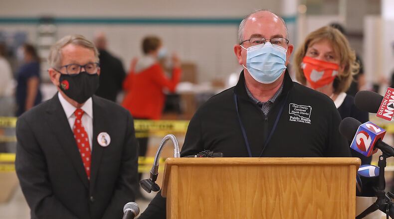 Clark County Health Commissioner Charles Patterson speaks to the media after giving Governor Mike DeWine and his wife, Fran, a tour of the Clark County COVID vaccine distribution center at the Upper Valley Mall on March 12. Clark County confirmed a fourth case of Multisystem Inflammatory Syndrome in Children (MIS-C) — a rare syndrome thought to be associated with COVID-19. BILL LACKEY/STAFF