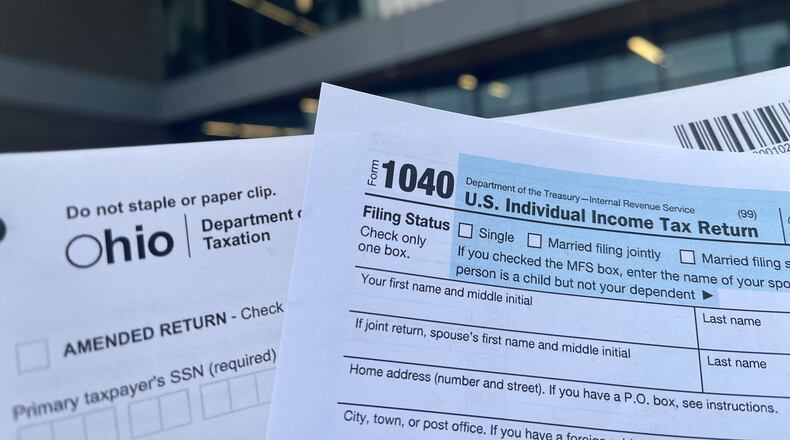 The Dayton Metro Library can provide paper copies of state and federal tax forms to distribute to visitors. CORNELIUS FROLIK / STAFF