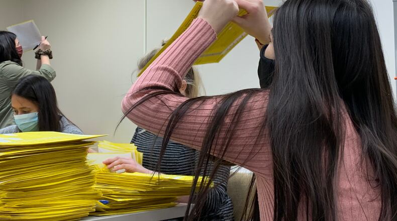 Montgomery County Board of Elections staff sort provisional ballots on Tuesday night. Josh Sweigart/Staff