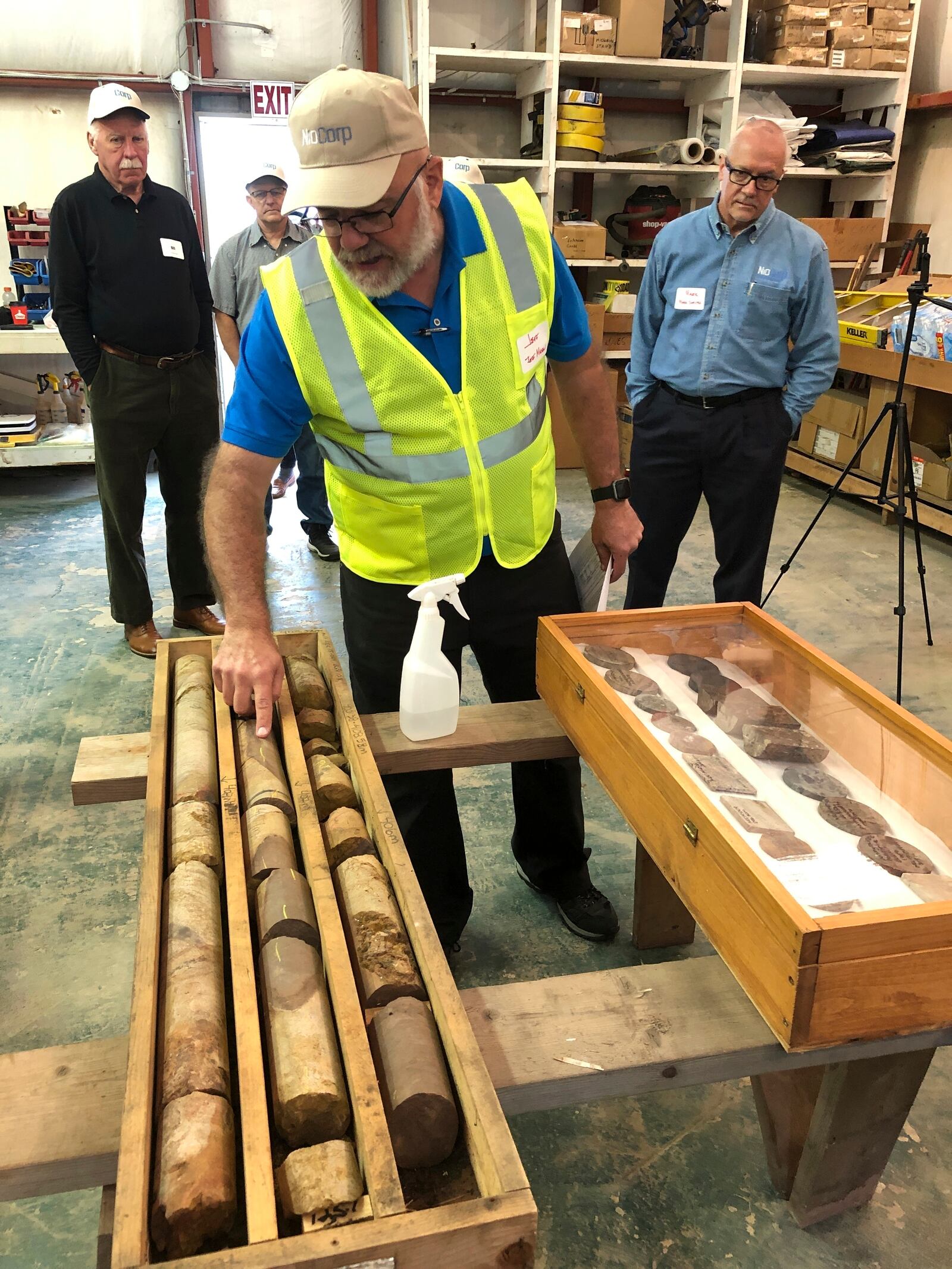 FILE - NioCorp Corporate Controller Jeff Mason shows investors core samples the mining company has collected while NioCorp CEO Mark Smith listens, Oct. 6, 2021 in Elk Creek, Neb. (AP Photo/Josh Funk, File)