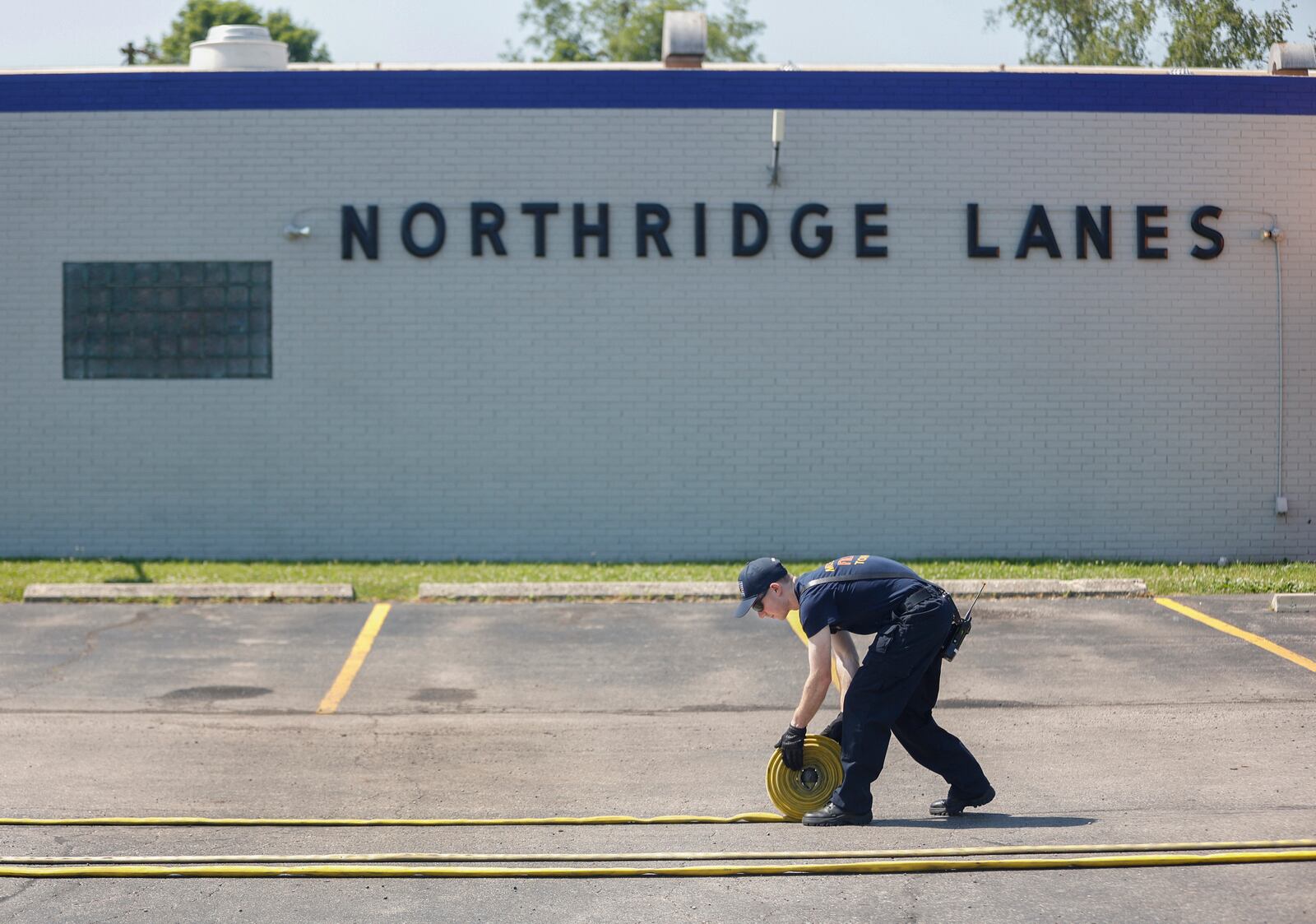 A firefighter investigates a fire that happed on Thursday, July 3, 2025, Northridge Lanes. No injuries were reported. JOSEPH COOKE/STAFF
