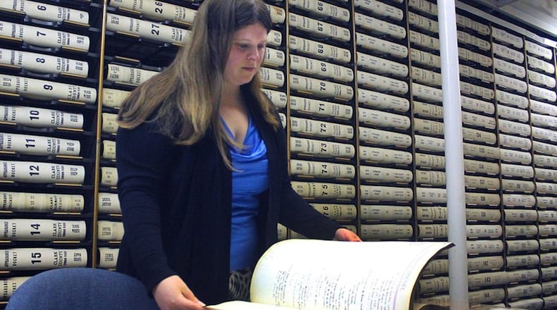 Clark County Common Pleas Clerk Melissa Tuttle looks at old case files in the clerks office. JEFF GUERINI/STAFF